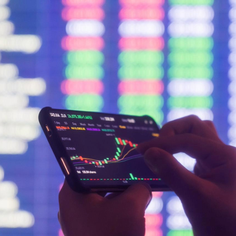 A person analyzing stock market data on a smartphone, illustrating the relationship between investments and tariffs in today's financial landscape